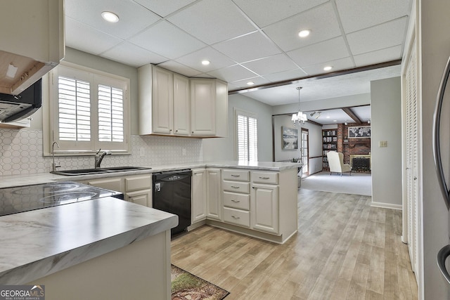 31 Festiva Dr, Newnan, GA 30263 - kitchen with light countertops, a healthy amount of sunlight, dishwasher, and a sink