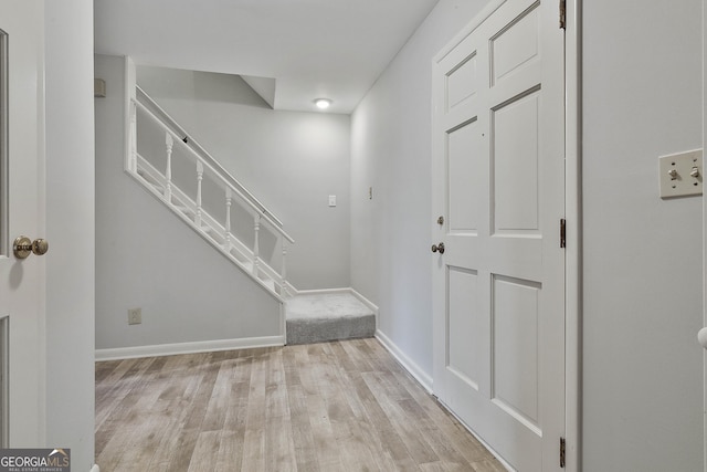 31 Festiva Dr, Newnan, GA 30263 - entrance foyer featuring baseboards, light wood finished floors, and stairs