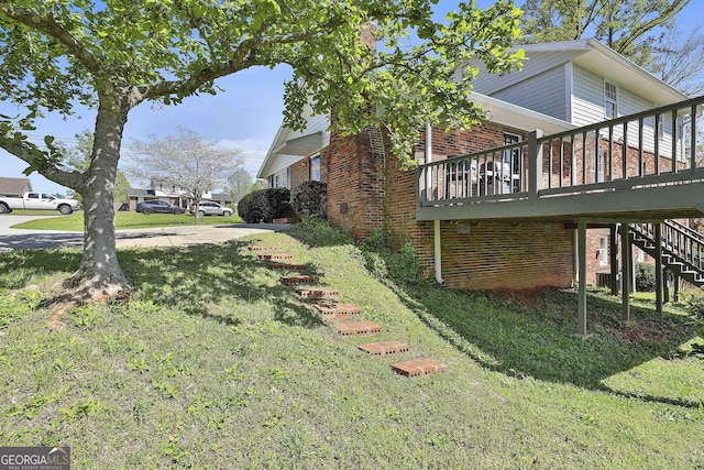 31 Festiva Dr, Newnan, GA 30263 - view of property exterior with stairway, cooling unit, brick siding, a yard, and a deck