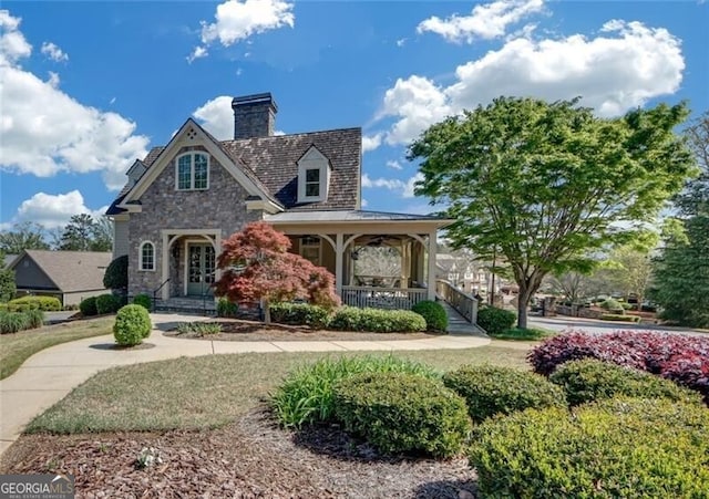 206 Glens Loop, Woodstock, GA 30188 - view of front of property with stone siding, covered porch, french doors, and a chimney