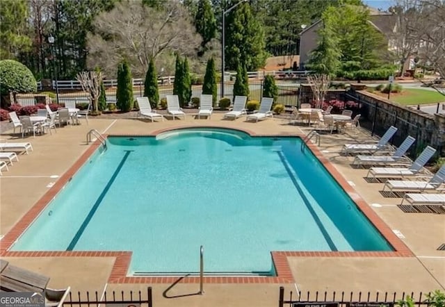 206 Glens Loop, Woodstock, GA 30188 - community pool with a patio and view of scattered trees