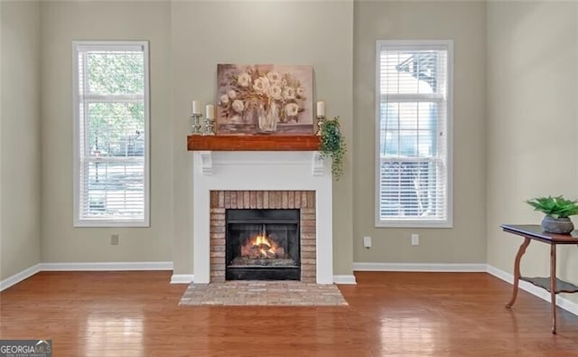 206 Glens Loop, Woodstock, GA 30188 - unfurnished living room featuring wood finished floors and a fireplace