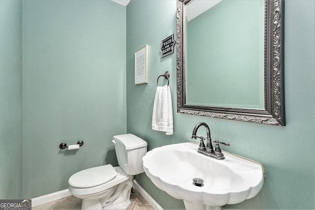 60 Bartlett Way, Dallas, GA 30157 - half bath featuring a sink, tile patterned floors, toilet, and baseboards