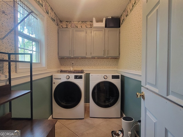 60 Bartlett Way, Dallas, GA 30157 - clothes washing area featuring cabinet space, wallpapered walls, washer and clothes dryer, light tile patterned floors, and a textured ceiling