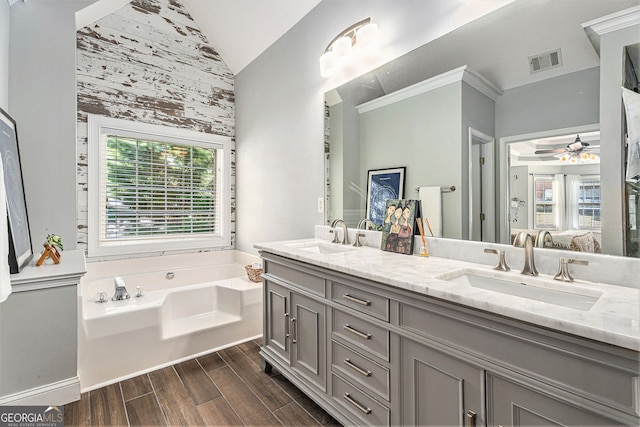 60 Bartlett Way, Dallas, GA 30157 - bathroom with lofted ceiling, a ceiling fan, plenty of natural light, a garden tub, and double vanity