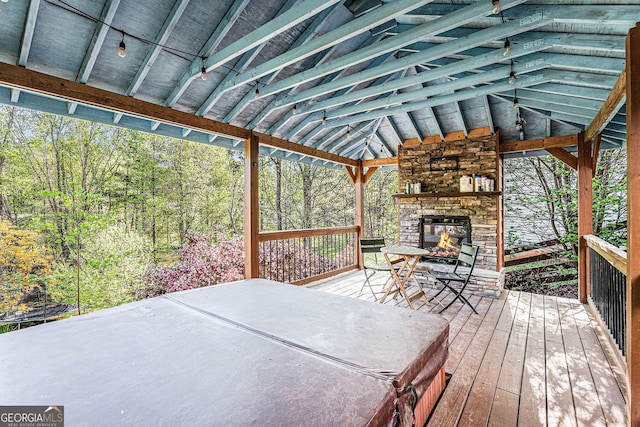 60 Bartlett Way, Dallas, GA 30157 - wooden deck featuring an outdoor stone fireplace and a patio area