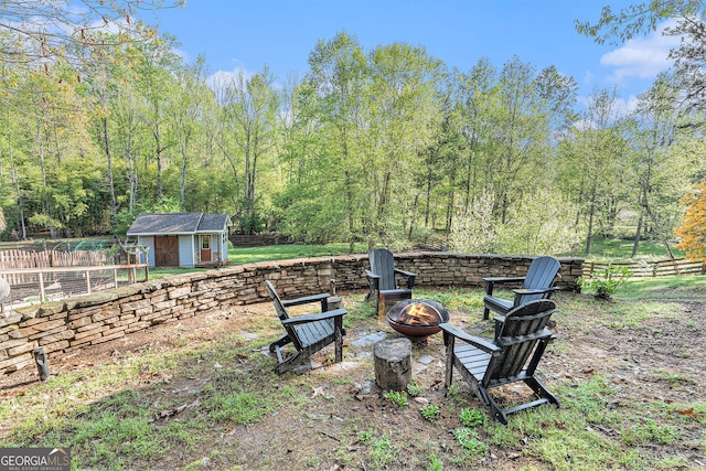 60 Bartlett Way, Dallas, GA 30157 - view of yard featuring a fire pit, fence, and an outdoor structure