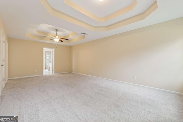 3892 Trillium Wood Trl, Snellville, GA 30039 - unfurnished room with a tray ceiling, a ceiling fan, and carpet floors