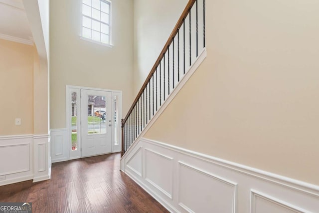 3892 Trillium Wood Trl, Snellville, GA 30039 - foyer with a decorative wall, a wainscoted wall, wood finished floors, a high ceiling, and stairs