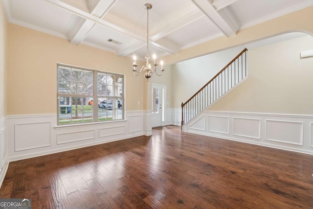 3892 Trillium Wood Trl, Snellville, GA 30039 - entryway featuring coffered ceiling, a chandelier, beamed ceiling, wood-type flooring, and a wainscoted wall