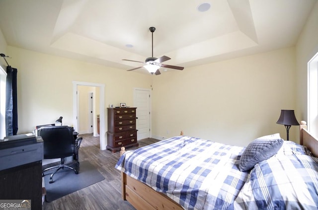 393 Old Good Hope Rd, Good Hope, GA 30641 - bedroom featuring dark wood-type flooring, a tray ceiling, baseboards, and ceiling fan