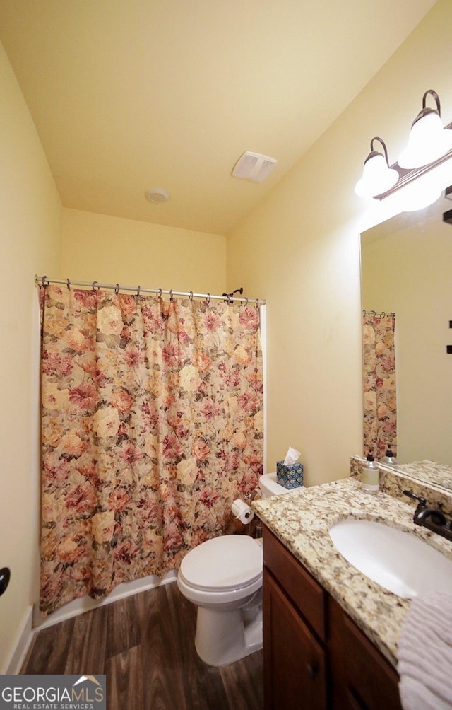 393 Old Good Hope Rd, Good Hope, GA 30641 - bathroom with visible vents, a shower with curtain, toilet, vanity, and wood finished floors