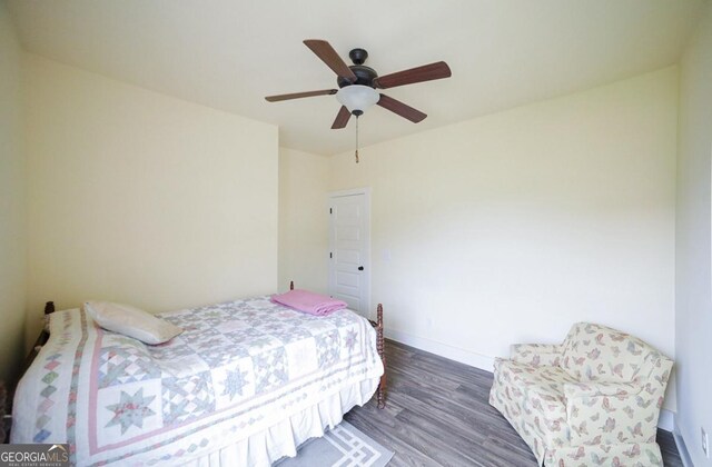 393 Old Good Hope Rd, Good Hope, GA 30641 - bedroom featuring baseboards, ceiling fan, and wood finished floors