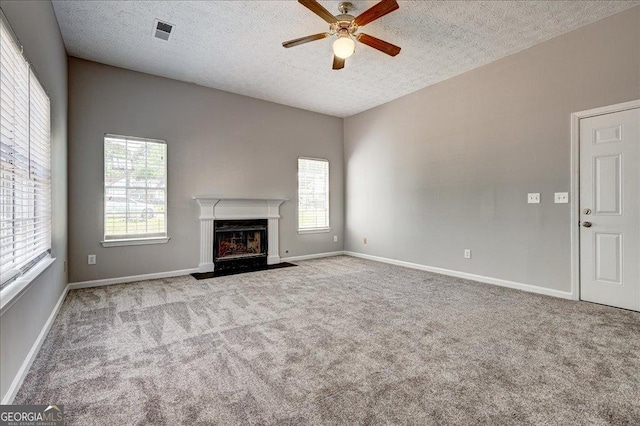 3612 River Mill Ct, Ellenwood, GA 30294 - unfurnished living room with carpet, a ceiling fan, visible vents, and a healthy amount of sunlight