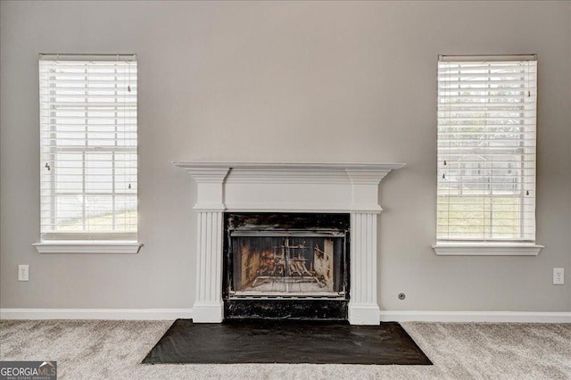 3612 River Mill Ct, Ellenwood, GA 30294 - room details featuring carpet floors, baseboards, and a fireplace with flush hearth