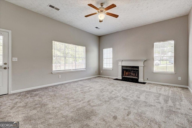 3612 River Mill Ct, Ellenwood, GA 30294 - unfurnished living room featuring visible vents, a ceiling fan, and carpet floors