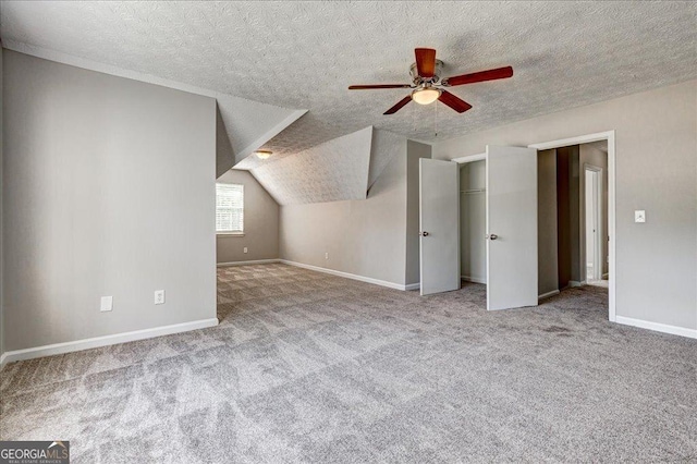 3612 River Mill Ct, Ellenwood, GA 30294 - bonus room featuring ceiling fan, baseboards, carpet flooring, and vaulted ceiling