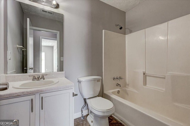 3612 River Mill Ct, Ellenwood, GA 30294 - full bath featuring vanity, a textured ceiling, toilet, shower / bathtub combination, and visible vents