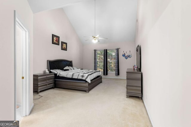 bedroom featuring light carpet, high vaulted ceiling, baseboards, and a ceiling fan