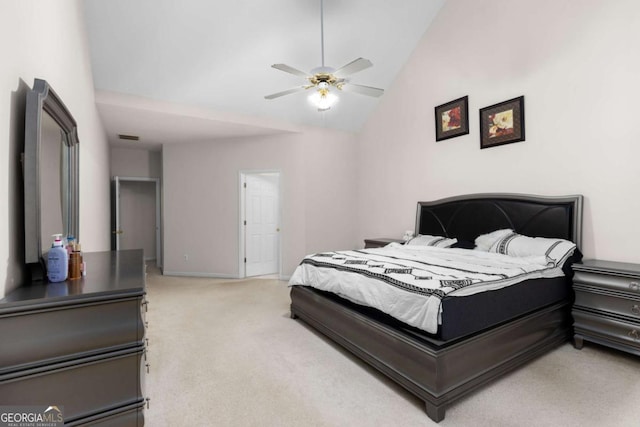 bedroom featuring visible vents, light colored carpet, ceiling fan, and lofted ceiling