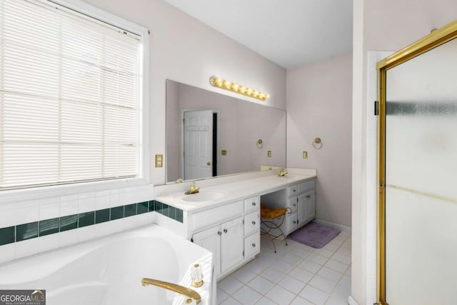 full bathroom with tile patterned flooring, vanity, a stall shower, and a garden tub