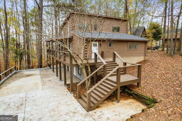 155 Indian Bend Dr, Lagrange, GA 30240 - rear view of house with log siding and stairs