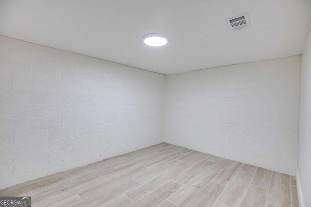155 Indian Bend Dr, Lagrange, GA 30240 - empty room with light wood-style flooring, visible vents, and concrete block wall