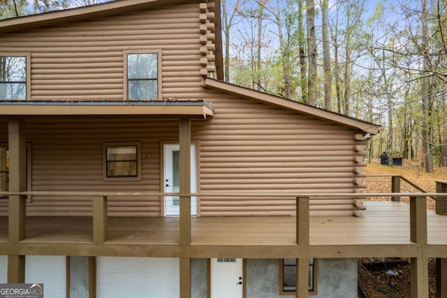 155 Indian Bend Dr, Lagrange, GA 30240 - back of property featuring an attached garage, log siding, and a balcony