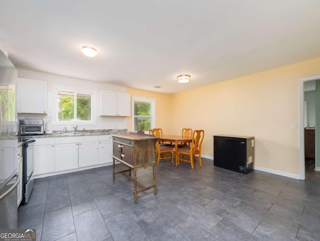 244 Sherwood Ln, Brunswick, GA 31525 - kitchen featuring white cabinets and electric stove