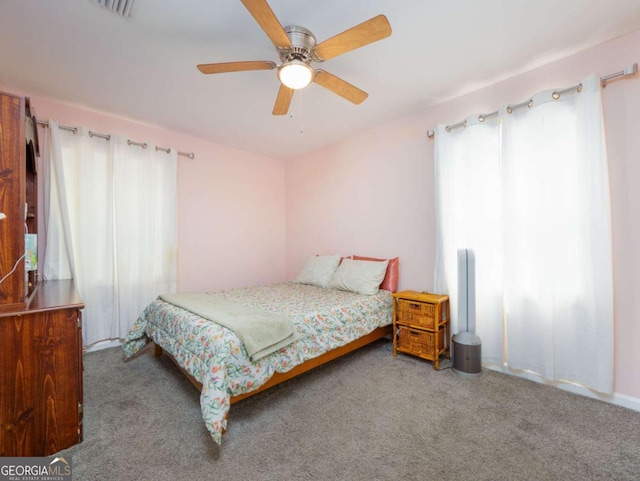 244 Sherwood Ln, Brunswick, GA 31525 - carpeted bedroom with a ceiling fan