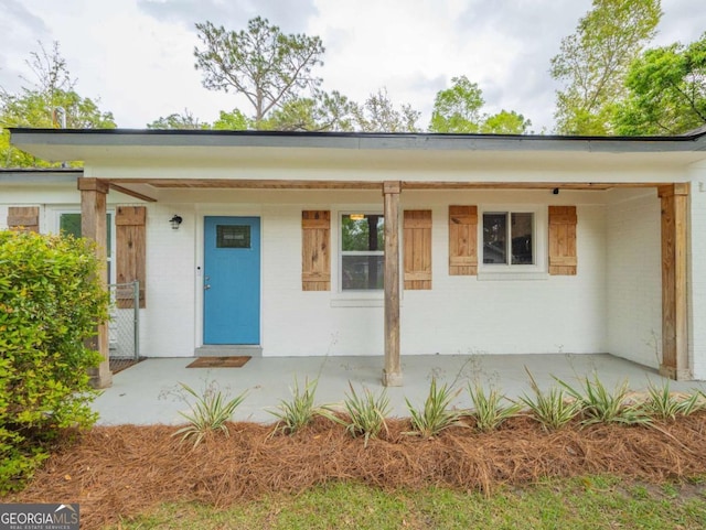 244 Sherwood Ln, Brunswick, GA 31525 - ranch-style home featuring brick siding and covered porch