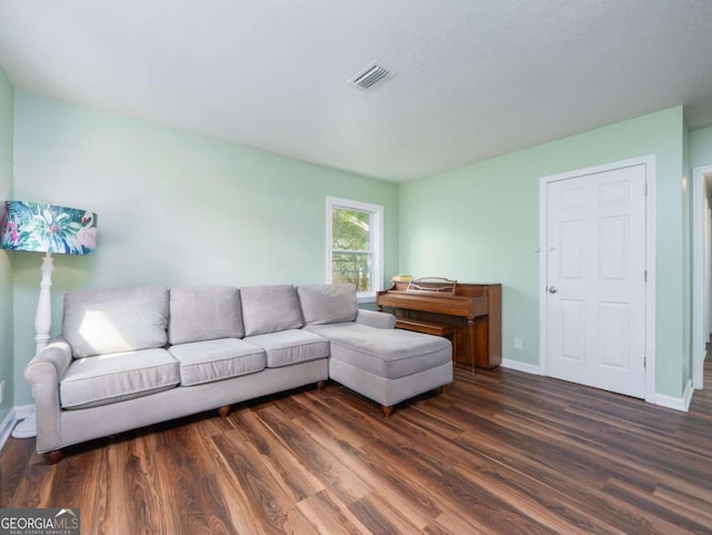 244 Sherwood Ln, Brunswick, GA 31525 - living room featuring dark wood finished floors and baseboards