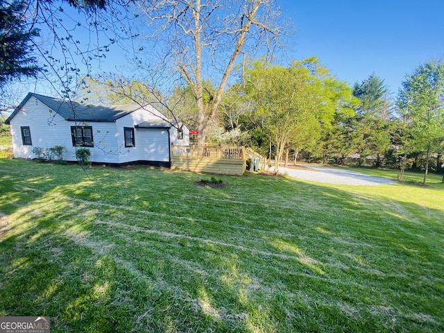 view of yard with a deck