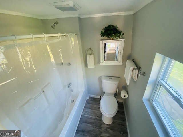bathroom featuring crown molding, wood finished floors, toilet, baseboards, and bathtub / shower combination