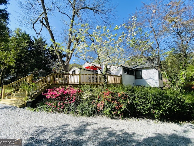 view of yard featuring a wooden deck