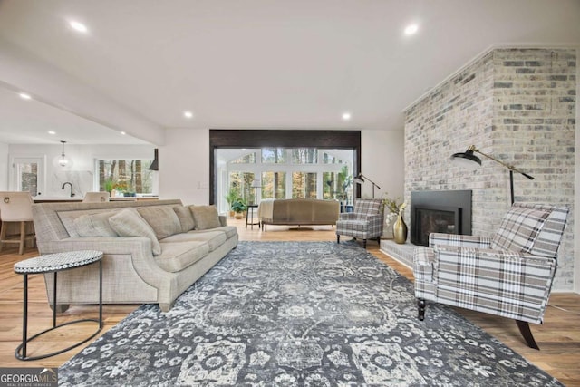 2433 Helmsdale Dr NE, Atlanta, GA 30345 - living area featuring wood finished floors, a fireplace, and recessed lighting