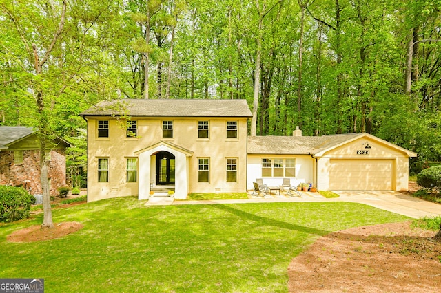 2433 Helmsdale Dr NE, Atlanta, GA 30345 - colonial-style house with a garage, a chimney, french doors, a front lawn, and driveway