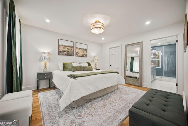 2433 Helmsdale Dr NE, Atlanta, GA 30345 - bedroom featuring recessed lighting, light wood-type flooring, baseboards, and connected bathroom