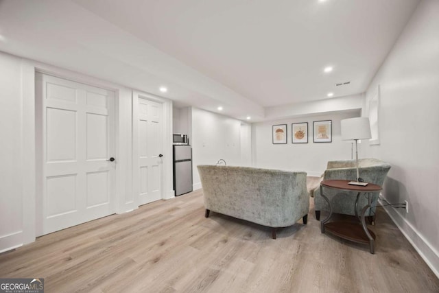 2433 Helmsdale Dr NE, Atlanta, GA 30345 - living area featuring visible vents, baseboards, recessed lighting, and light wood-style floors
