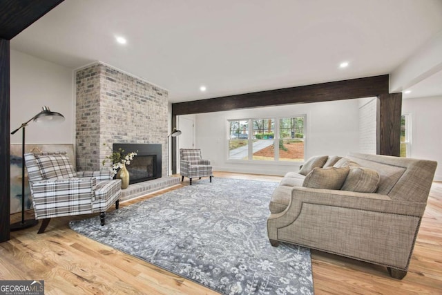 2433 Helmsdale Dr NE, Atlanta, GA 30345 - living area with recessed lighting, a brick fireplace, and wood finished floors
