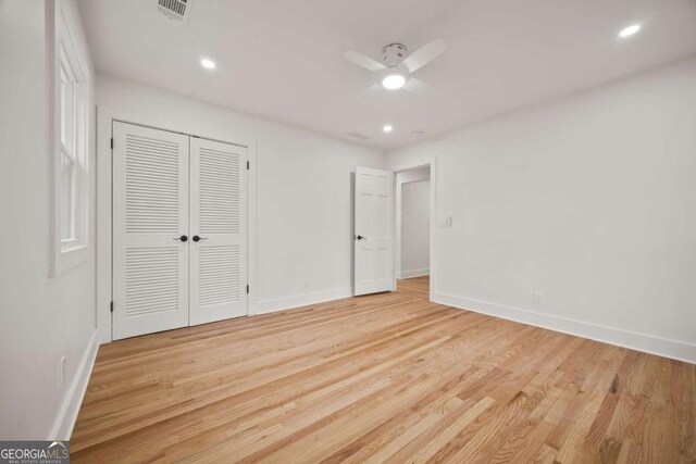 2433 Helmsdale Dr NE, Atlanta, GA 30345 - unfurnished bedroom featuring visible vents, baseboards, a closet, recessed lighting, and light wood-style flooring