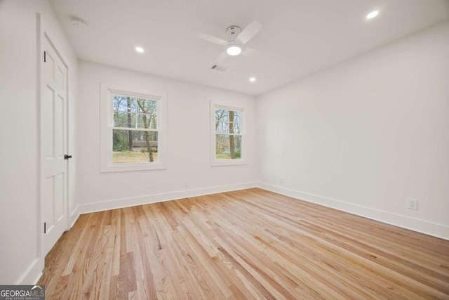2433 Helmsdale Dr NE, Atlanta, GA 30345 - spare room featuring light wood-style flooring, baseboards, a ceiling fan, and visible vents