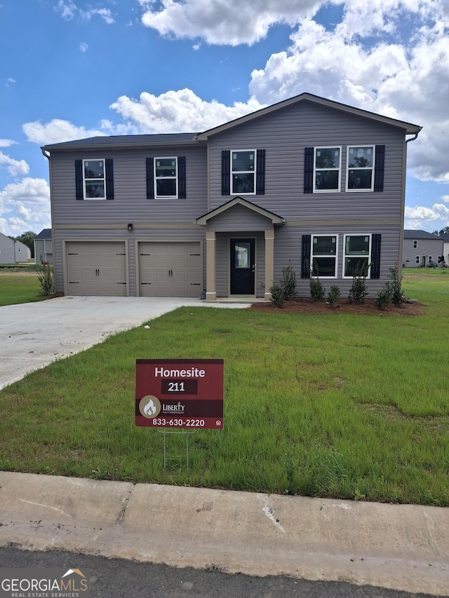 view of front of house with an attached garage, driveway, and a front lawn