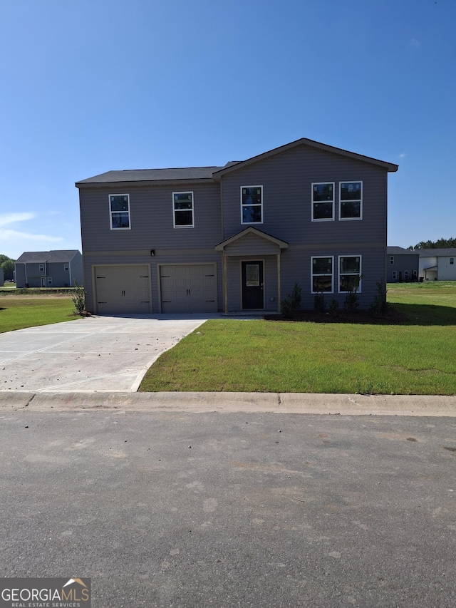 view of front of home featuring a garage, concrete driveway, and a front lawn