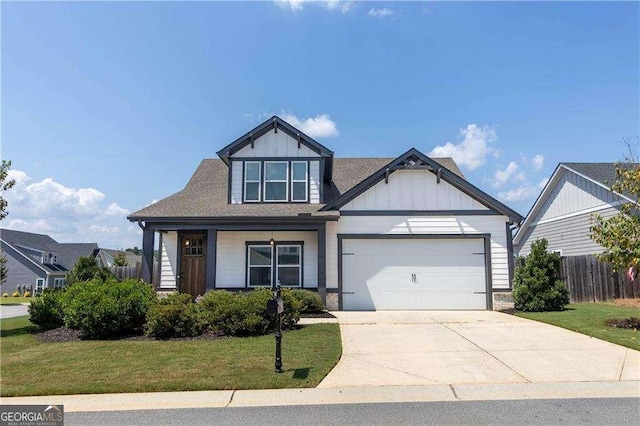 craftsman inspired home with a garage, board and batten siding, fence, concrete driveway, and a front lawn