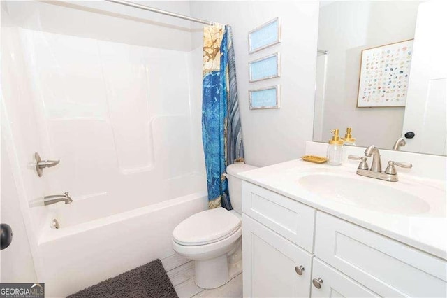 full bathroom featuring toilet, shower / tub combo, and vanity