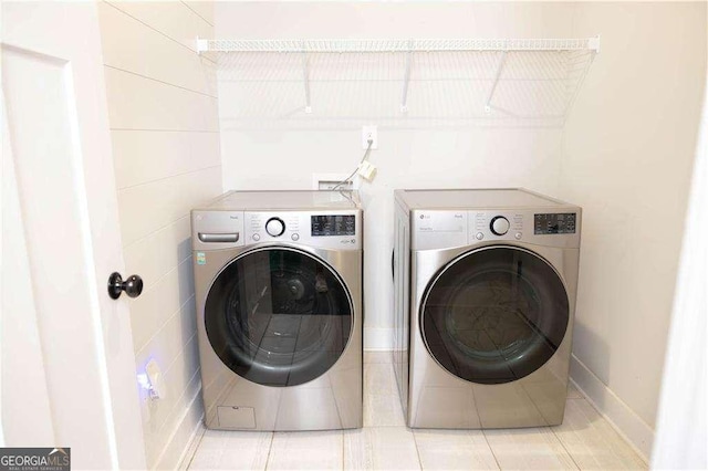 laundry area featuring separate washer and dryer and laundry area