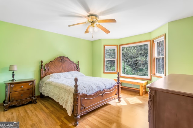 bedroom featuring light wood-type flooring and a ceiling fan