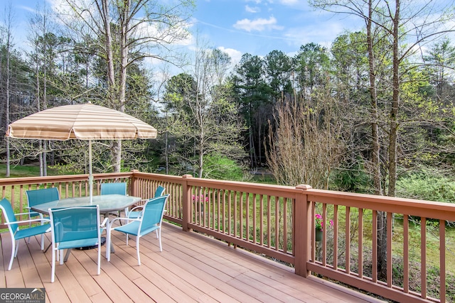 wooden deck with outdoor dining space