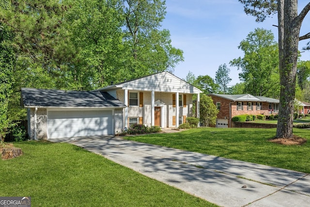 greek revival house featuring brick siding, driveway, a garage, and a front yard